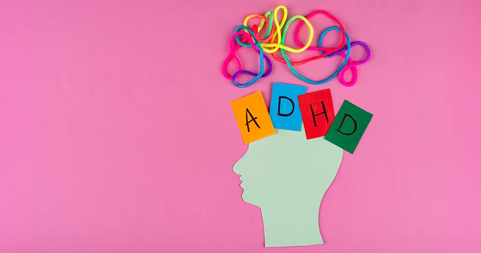 Woman thoughtfully reflecting on common ADHD in women symptoms such as inattention, overwhelm, and internal restlessness
